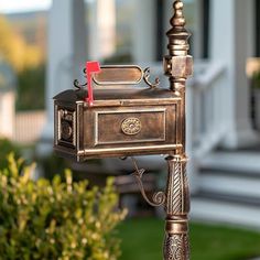 an old fashioned mailbox with a red flag sticking out of it's side