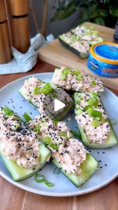 cucumbers with tuna and sesame seeds on a plate