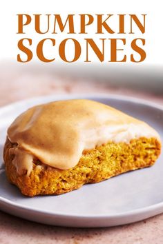 pumpkin scones on a plate with frosting drizzled on top and the words, pumpkin scones