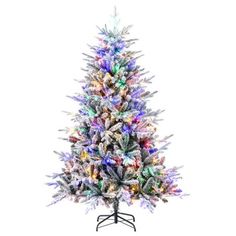 a multi - colored christmas tree with lights on it's base and a white background