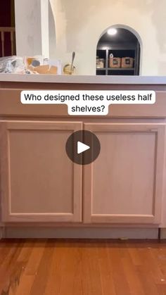 an image of a kitchen with the words who designed these cabinets half shelving?