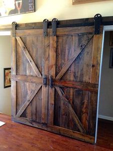 an open barn door with the words handmade on it