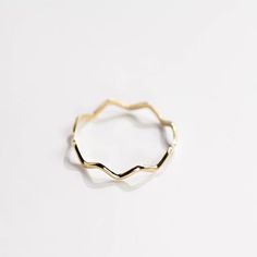 A dainty gold ring with zig zag pattern. A stacking gold ring for women, minimal and simple that adds glam to every outfit. This stacking wavy band can be used a an alternative wedding band as well. The best Christmas gift. 100% handcrafted with love!D E T A I L S● Metal: 14K solid gold, 14K white gold or 14K rose goldR I N G ∙ S I Z I N GFor General Reference:● we use standard US Ring Sizing● an average women's ring finger is size 6-7● each ring is custom made upon order, in any desired size.● Minimalist 14k Gold Wavy Ring, Gift Wavy Stackable Rings, Everyday Yellow Gold Wavy Jewelry, Gift Stackable Wavy Rings, Minimalist Yellow Gold Wavy Ring, Minimalist Wavy Yellow Gold Ring, Everyday Wavy Yellow Gold Jewelry, Minimalist 14k Gold Wavy Jewelry, Gold Wavy Rings For Anniversary