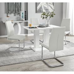 a white table and chairs in a room