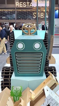 a robot made out of cardboard boxes on display