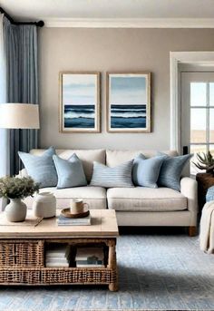 a living room filled with furniture and pillows on top of a table next to a window