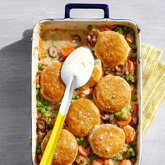 a casserole dish filled with meatballs and vegetables