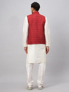 Vastramay Men's Maroon Matka Silk Nehru Jacket With Cream Silk Blend Kurta Pyjama Set A classic ensemble, this maroon matka silk Nehru jacket paired with a cream silk blend kurta pyjama set is perfect for special occasions. The jacket features a mandarin collar and full sleeves, while the kurta comes with a round neck and full sleeves. The pyjama is designed with an elasticated waistband for a comfortable fit. Features: Maroon Matka Silk Nehru Jacket Cream Silk Blend Kurta Pyjama Set Mandarin Co Maroon Jacket, Kurta Cotton, Kurta Pyjama, Nehru Jacket, Nehru Jackets, Cream Silk, Full Sleeves, Pyjama Set, Mandarin Collar