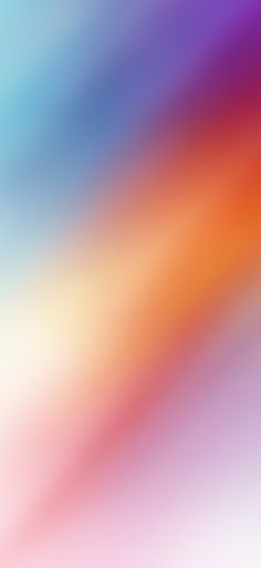 a blurry image of an orange, blue and pink background