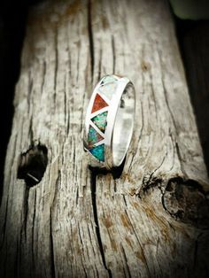 Want this inlaid with different gemstones? Please message me about doing a custom Order 925 Sterling Silver Opal Ring Sterling silver Navajo designed and revived ring inlaid with the Red, Green, White, Blue and Pink opals. Width of ring face: 1/4 of an inch tall. Weight: A Size 11 is 6.8 grams, weight varies for ring size. Multicolor Inlay Rings For Anniversary, Southwestern Style Silver Wedding Rings, Silver Southwestern Style Wedding Ring, Anniversary Multicolor Inlay Rings, Southwestern Inlay Jewelry For Anniversary, Southwestern Style Inlay Jewelry For Anniversary, Multicolor Opal Jewelry For Anniversary, Southwestern Multi-stone Jewelry For Anniversary, Wedding Ring With Inlay Jewelry