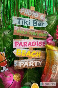 there are many different signs on this party sign post that say, tiki bar paradise beach party