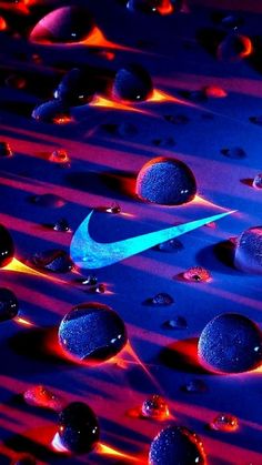 the nike logo is glowing in blue and red light with drops of water around it