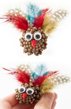 the pine cone bird is made with googly eyes and feathers