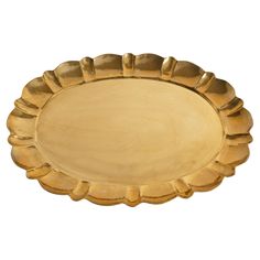 a gold metal tray with scalloped edges on a white background for use as a serving platter