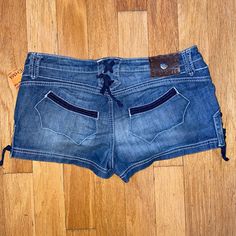 $149 Antik Denim Shorties Denim Lace-Up Western Shorts Size 31 Turquoise Rivets Y2k 98% Lcotton, 2% Spandex - Soft And Stretchy Branded Hardware Polished To High Shine, Set With Faux Blue Turquoise Measurements: Waistband 17.5" Hips 21" Rise 8 1/4" Inseam: 1.5"; Leg Opening: 12 1/2" Y2k Denim Bottoms With Built-in Shorts, Y2k Short Bottoms With Belt Loops, Y2k Style Short Bottoms With Belt Loops, Y2k Mid-rise Denim Shorts, Y2k Denim Blue Shorts With Pockets, Y2k Blue Cutoff Bottoms, Y2k Style Blue Cutoff Bottoms, Y2k Denim Shorts With Pockets, Y2k Medium Wash Short Bottoms