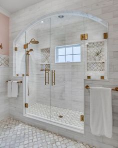 a bathroom with a walk in shower next to a sink