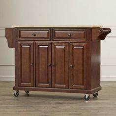 a kitchen island with two drawers on wheels