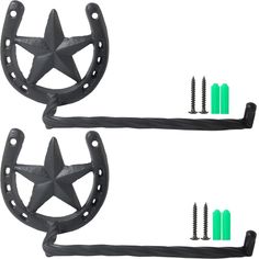 two black metal stars with screws on each side and one has green pins in the middle