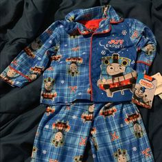 Thomas The Tank Engine “Joy Express” Christmas Pajamas. Pajamas Are Two Pieces. Top Buttons. Cute Christmas Bedtime Sets, Cute Bedtime Christmas Sets, Cute Bedtime Sets For Christmas, Blue Cotton Christmas Sleepwear, Blue Cotton Holiday Sleepwear, Holiday Bedtime Sets With Long Sleeves, Christmas Playtime Sets With Long Sleeves, Playful Christmas Playtime Clothing Sets, Playful Christmas Playtime Sets