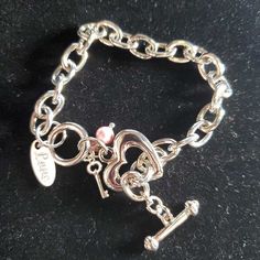 Artist Gail Bonsignore’s nickel-free crystal jewelry adds a touch of sparkle and personality to any outfit. This beautiful piece was handset by Gail in St. Johns, Florida. She hopes you enjoy her creations as much as she enjoys making them! Trendy Personalized Silver Heart Bracelet, Elegant Pink Metal Crystal Bracelet, Personalized Elegant Crystal Bracelet, Valentine's Day Silver Crystal Bracelets, Elegant Personalized Heart Metal Bracelet, Nickel-free Metal Charm Bracelet For Valentine's Day, Elegant Nickel-free Heart Bracelet For Valentine's Day, Adjustable Crystal Jewelry With Charms, Metal Crystal Bracelet With Lobster Clasp As Gift