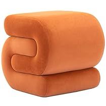 two orange pillows stacked on top of each other