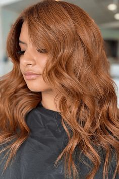 This sumptuous brown ginger hairdo radiates warmth and depth with its vibrant, fiery hues that blend harmoniously, creating a sun-kissed aesthetic. Cascading in soft, voluminous waves, the hair has been styled to accentuate its natural flow and movement, beautifully framing the wearer's features. The - Click to see more of Embrace Your Ginger Charm: 40 Captivating Brown Ginger Hair Styles to Elevate Your Look and follow us for more hairstyle ideas. // Photo Credit: Instagram @sleeksocietysalon Ginger Hair Before And After, Low Maintenance Ginger Hair, Soft Autumn Red Hair, Cognac Hair Color, Ginger Ombre Hair, Golden Ginger Hair, Ginger Spice Hair, Ginger Hair Styles, Light Ginger Brown Hair