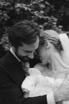 a black and white photo of a bride and groom