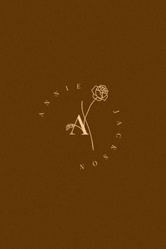 a clock with a flower in the middle on a brown background that says it is noon