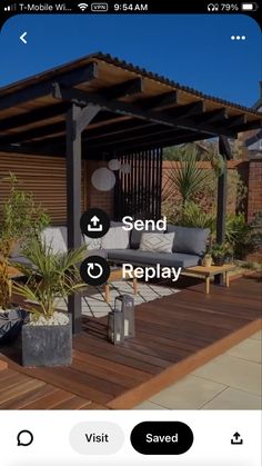 an outdoor living area with couches, tables and plants on the deck in front of a house