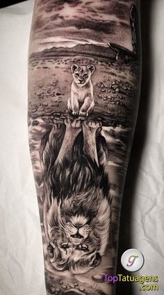 a man's leg with an animal and lion tattoo on the side of his leg