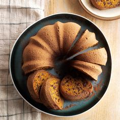 a bundt cake with chocolate frosting and sprinkles on a plate