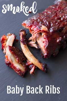 baby back ribs with bbq sauce on top and the words, smoked baby back ribs