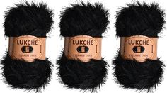 three skeins of black fluffy yarn with the words lurche on them