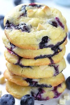 a stack of blueberry cookies sitting on top of a table