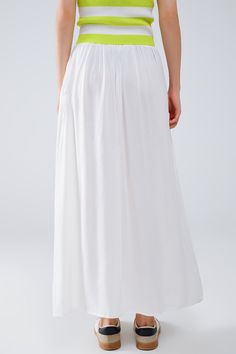 Introducing our stunning Maxi Skirt in White Fluid Fabric with Elastic Waist, a versatile and chic addition to your wardrobe that exudes effortless bohemian style. Crafted from lightweight woven fabric made of 100% viscose, this skirt offers both comfort and elegance.  The full-length design and relaxed fit create a flowing silhouette that's perfect for any occasion, whether you're strolling along the beach or attending a summer soirée. The elastic waistband ensures a comfortable and customizable fit, while side pockets add a practical touch.  Pair this skirt with a simple tank top for a casual daytime look, or dress it up with a blouse and statement jewelry for a more polished ensemble. However you style it, this maxi skirt is sure to make a statement wherever you go.  Please note that th Tan Scarf, Flowy Maxi Skirt, Simple Tank Tops, Flowy Maxi Skirts, Boho Fabric, Summer Soiree, Skirt Jumpsuit, Scarf Headband, Estilo Boho