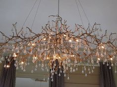 a chandelier hanging from the ceiling in a room