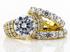 Charles Winston for Bella Luce ® white diamond simulant 19.68 ctw round, Eterno ™ 18k yellow gold over sterling silver ring with bands. Measures approximately 0.94" L x 0.69" W and is not sizeable. The diamond equivalent weight is 10.70 ctw. Gold Cubic Zirconia Bridal Sets With Center Stone, Gold Bridal Sets With Center Stone Cubic Zirconia, Luxury Yellow Gold Bridal Sets, Gold Bridal Sets With Brilliant Cut Fine Jewelry, Gold Bridal Set With Round Cut Center Stone, Yellow Gold Bridal Sets With Diamond Accents, Gold Bridal Sets With Prong Setting, Gold Bridal Sets With Diamond Cut, Luxury Gold Diamond-cut Bridal Sets