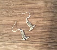 Check out these adorable detailed silver cowboy boot earrings. Hangs on silver plated hooks with clear backs. Check last photo for size. Nickel-free Western Style Earrings, Nickel-free Adjustable Western Earrings, Adjustable Nickel-free Western Earrings, Silver Dangle Western Earrings, Cowboy Boot Earrings, Boot Earrings, Cowgirl Necklaces, Antler Earrings, Deer Jewelry