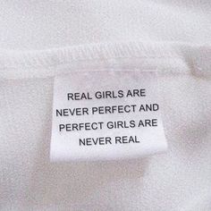 a label on a white shirt that says real girls are never perfect and perfect girls are never real