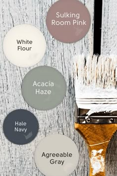 some paint colors that are being used on a wooden surface with the words accacia haze, hale gray, and sulking room pink