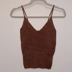 Brandy Melville Women’s Brown Knit Sweater Tank Top. Stretchy And Soft Material. One Size Fits All, But Fits Like A Small. Never Worn Brown Fitted Knitted Top, Fitted Brown Knitted Top, Brown Textured Knit V-neck Top, Casual Pointelle Knit Cami Top, Fall Knit Crop Top Tank Top, Fall Knit Crop Tank Top, Fitted Knitted V-neck Tank Top, Brown Fitted Knit Crop Top, Fitted Brown Knit Crop Top