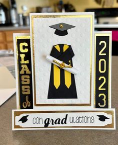 congratulations card with graduation cap and tassel on it, sitting on top of a table