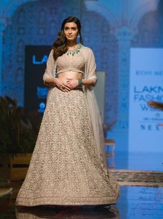 Ridhi Mehra - Champagne & Ivory Lehenga Set - INDIASPOPUP.COM Ivory Lehenga, Ridhi Mehra, Net Blouses, Embroidered Crop Tops, Lehenga Skirt, Embroidered Lehenga, Elegant Sets, Organza Dupatta, Indian Fashion Designers