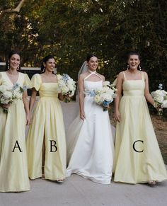 four bridesmaids in yellow dresses with their names on the front and back, standing together