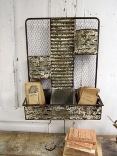 an old metal shelf with many boxes on it and some papers in front of it