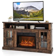 an entertainment center with a fireplace and television on it's stand in front of a white background