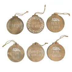 six ornaments with the names of different countries hanging from strings on a white background, each decorated with an ornament