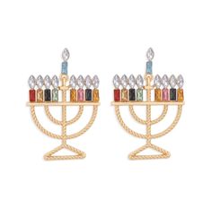 a pair of gold earrings with multicolored stones on top of each earring