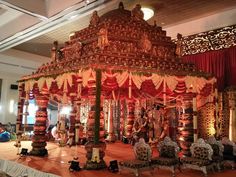 an elaborately decorated stage set up for a wedding