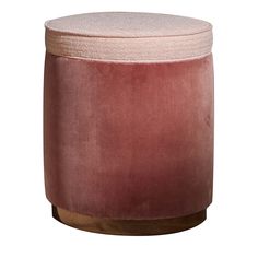 a pink stool with wooden legs and a round cushion on the top, against a white background